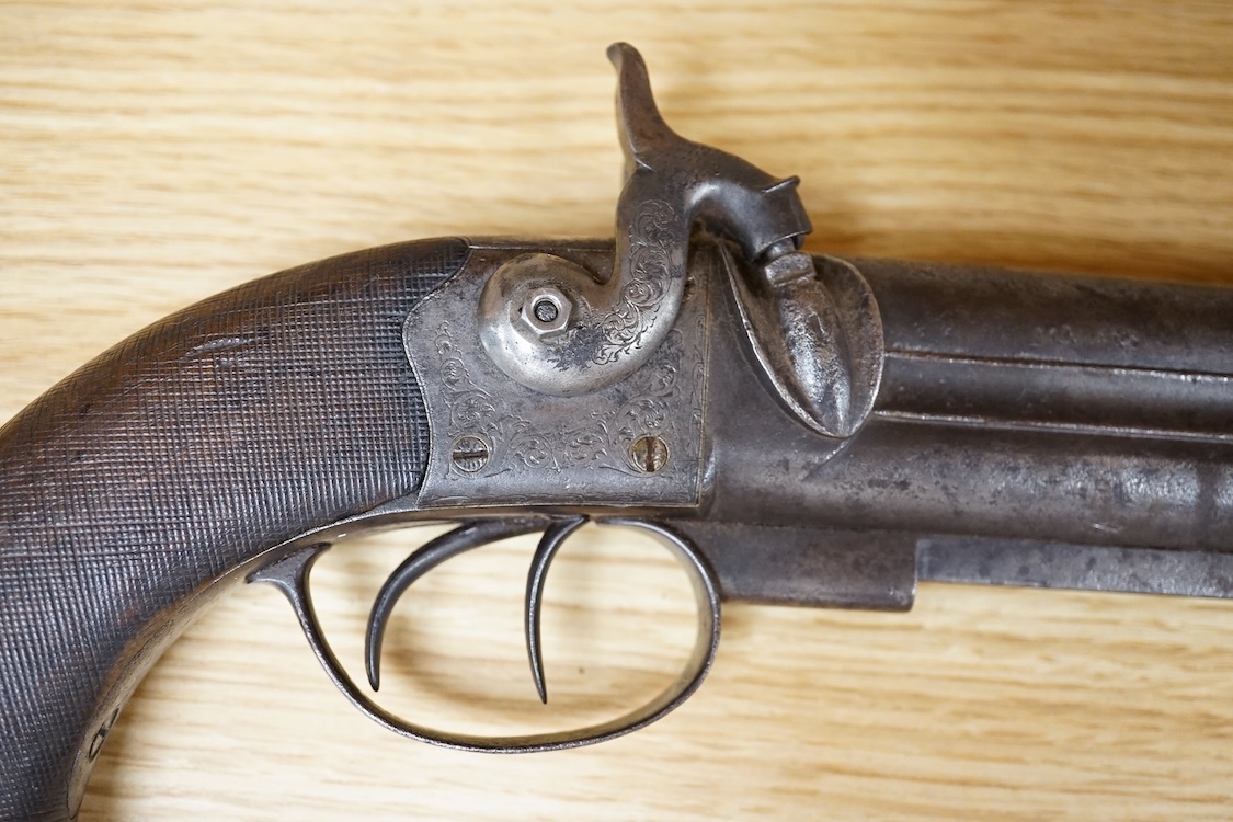 A double barrel over and under 16 bore percussion holster pistol by J. Beattie, barrels 14cm, London proofed, engraved; J. Beattie, Regent Street, London, with foliate engraved boxlock action and finely chequered walnut
